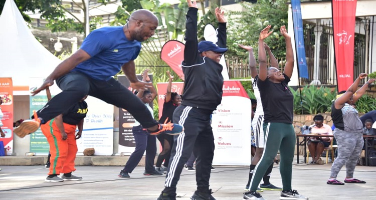 A member of staff doing star jumps at the launch of the monthly sessions