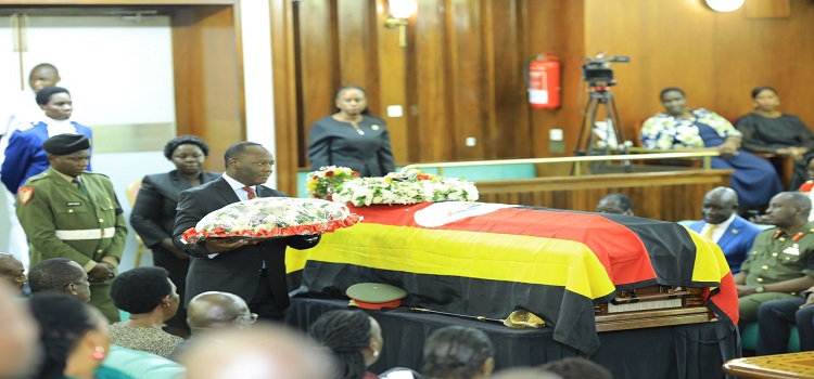 Mpuuga as he prepared to lay a wreath on the coffin